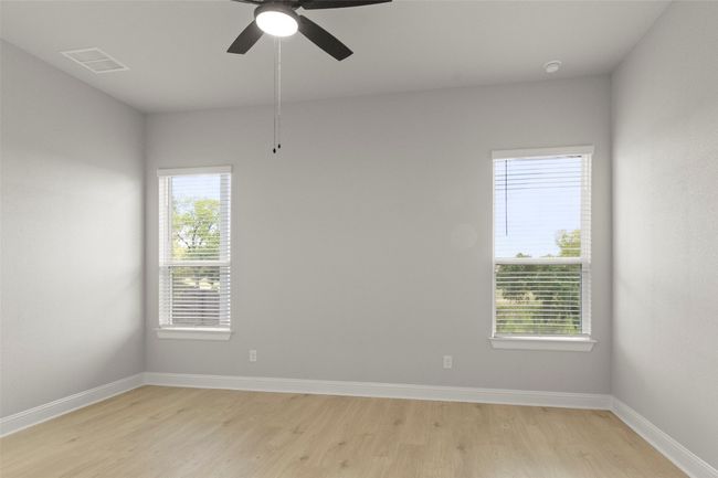Spare room with light wood-style floors and a ceiling fan | Image 24