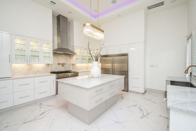 Kitchen features upscale appliances plus glass upper cabinetry to showcase your China. | Image 17
