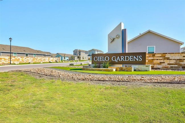Community sign with a lawn and a residential view | Image 4