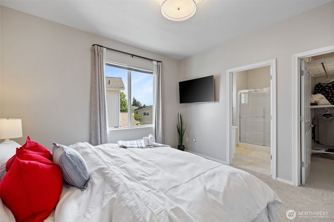 View of Primary bedroom showing access to the Primary bath and walk-in closet | Image 25