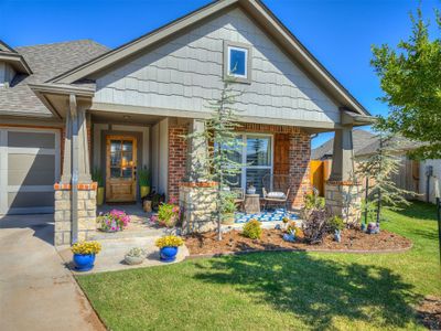 View of front of home featuring a garage and a front yard | Image 2