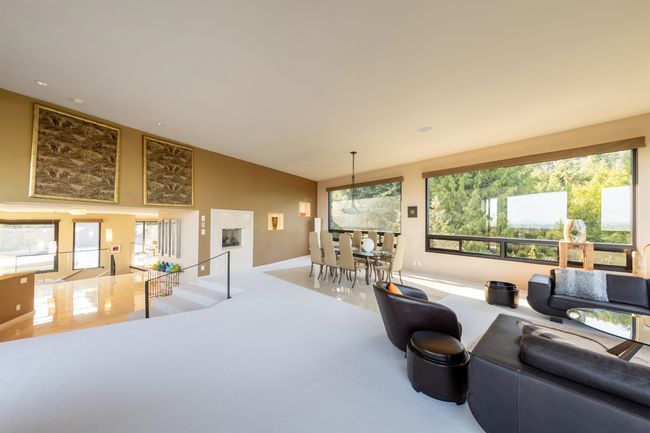 Living area with recessed lighting, a healthy amount of sunlight, high vaulted ceiling, and baseboards | Image 37