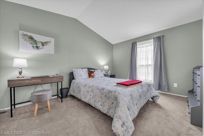 Spacious primary bedroom with vaulted ceiling | Image 29