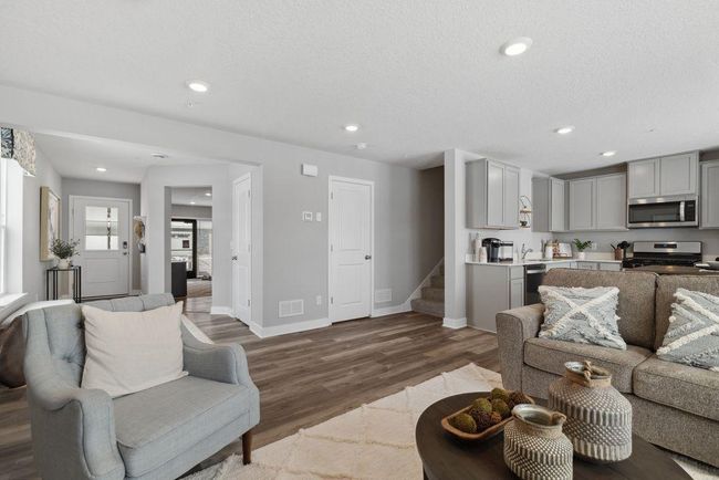 Open concept living. Our smart home package is included in every home. Photo is of model home. Colors and options may vary. Ask Sales Agent for details. | Image 13