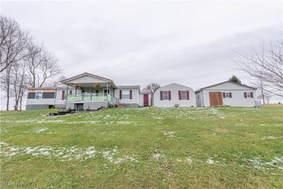 View of front of property featuring a front yard | Image 1