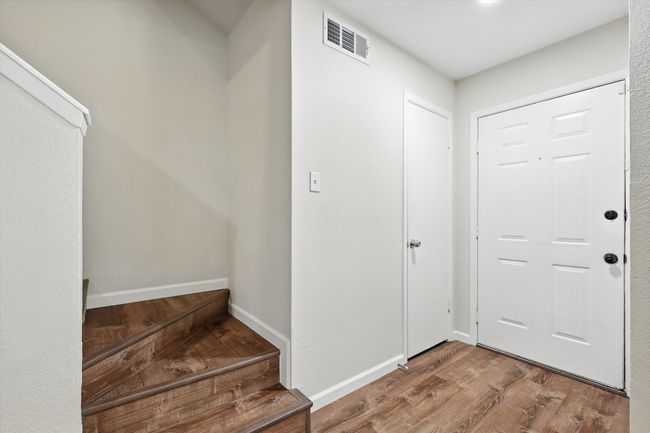 Foyer entrance featuring wood finished floors and baseboards | Image 6