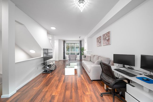 Office with wood finished floors and baseboards | Image 4