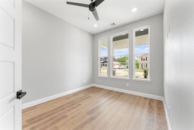 Spare room with light wood-style floors, a ceiling fan, baseboards, and visible vents | Image 15