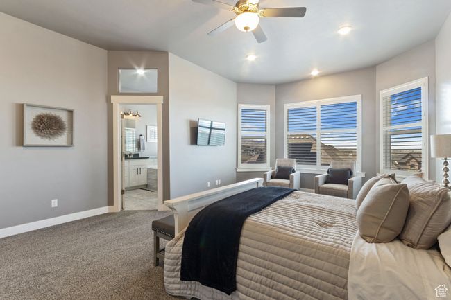 Carpeted bedroom featuring recessed lighting, ensuite bath, a ceiling fan, and baseboards | Image 13