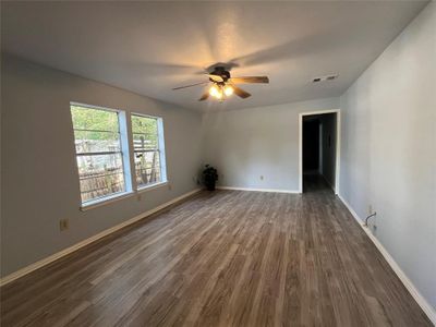 Spare room with ceiling fan and dark hardwood / wood-style floors | Image 3