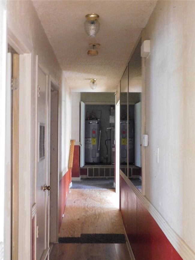 Hall featuring water heater and hardwood / wood-style floors | Image 10
