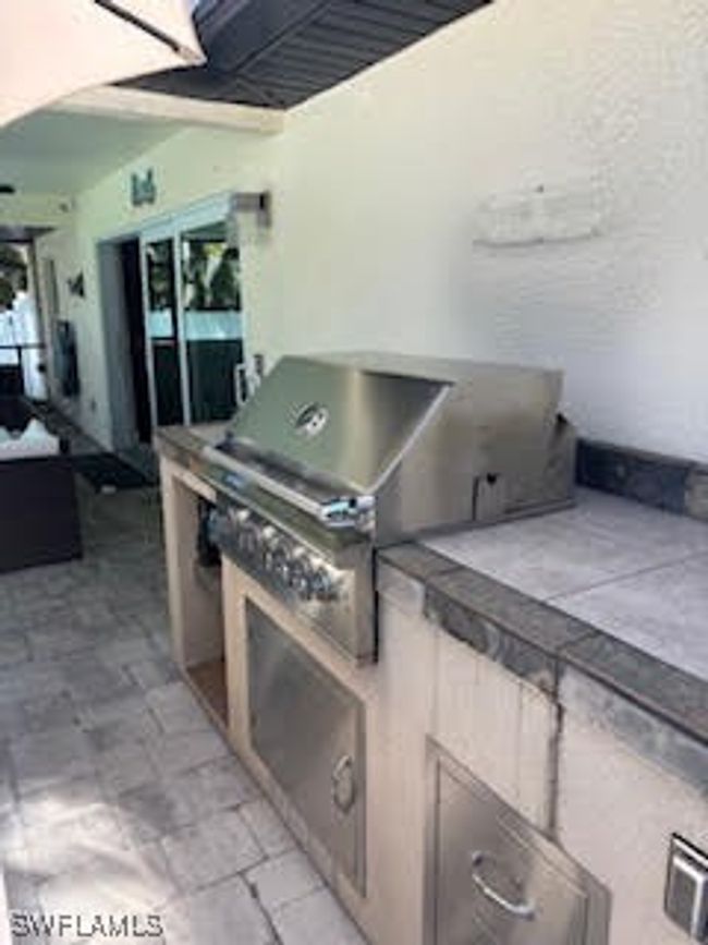 View of patio featuring exterior kitchen | Image 32