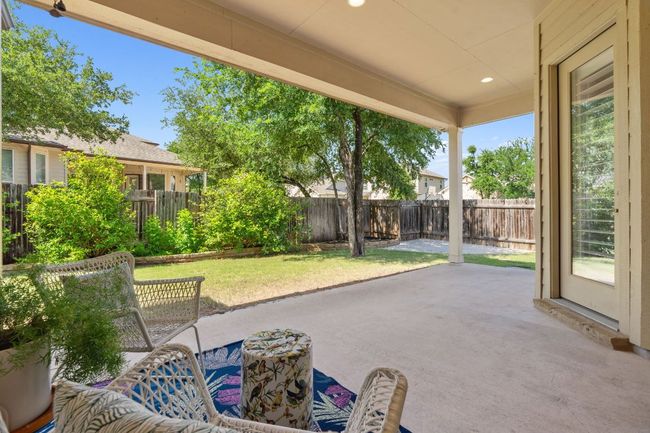 Stepping outside, you’ll find a beautifully landscaped backyard. | Image 31