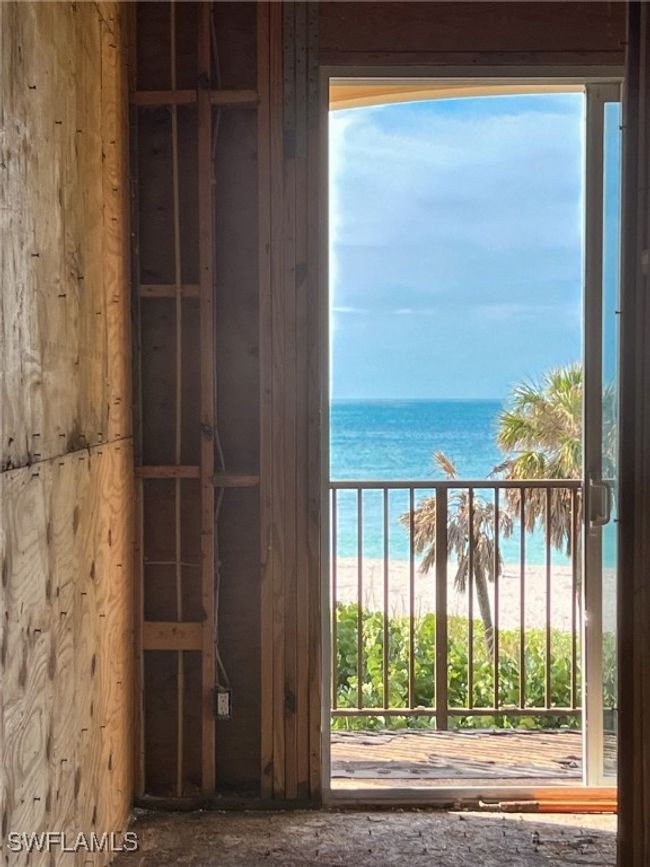 Balcony with a water view and a view of the beach | Image 40
