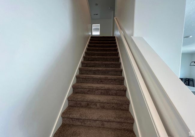 Staircase featuring carpet flooring and baseboards | Image 14