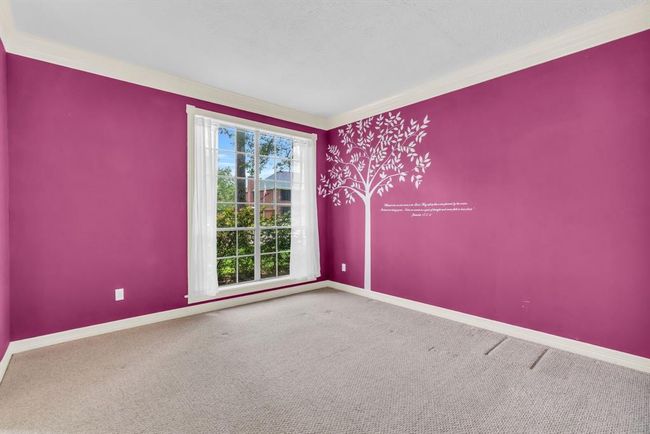 Living room has a custom painted mural. | Image 7