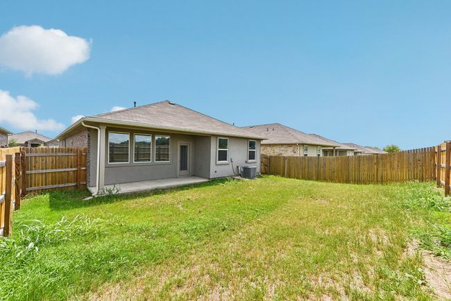 True Backyard Privacy: Backing to protected greenbelt, this fully fenced yard offers peace and space. | Image 21