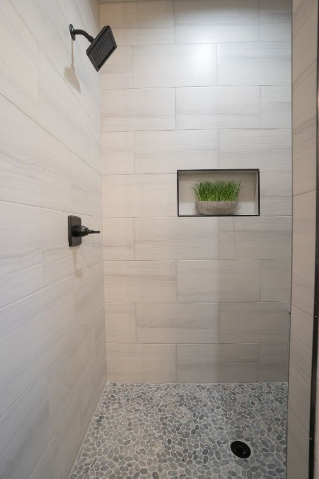 Bathroom featuring a tile shower | Image 15