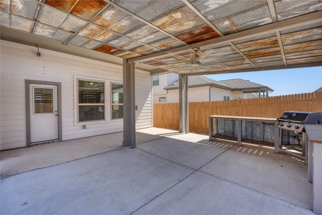 View of patio with area for grilling and fence | Image 38