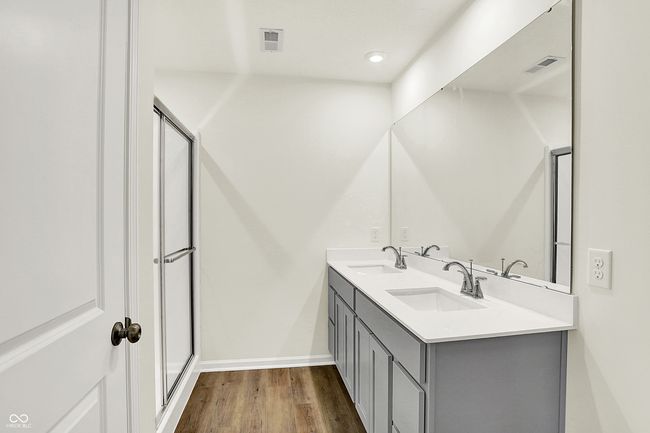 full bathroom with wood finished floors, visible vents, and a sink | Image 24