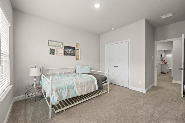 Carpeted bedroom with multiple windows, a closet, and recessed lighting | Image 19