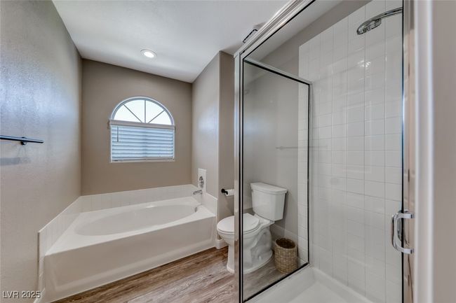 Full bath with a garden tub, a stall shower, and wood finished floors | Image 21