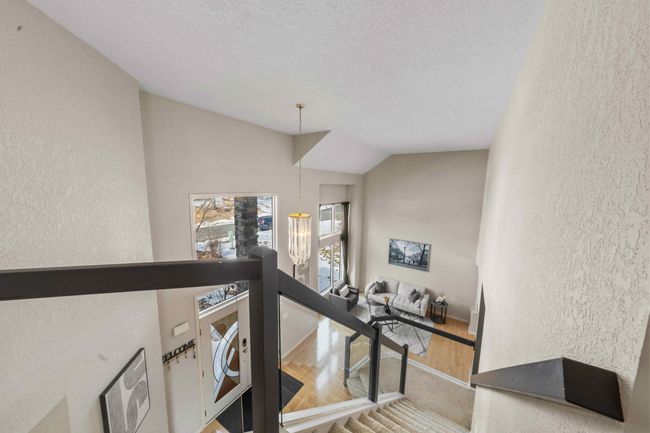 View from upper level into the family room | Image 49