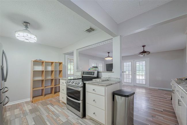 Large dining area for the whole family to gather for dinner and multiple doors that open directly to outside to enjoy nature also. | Image 19