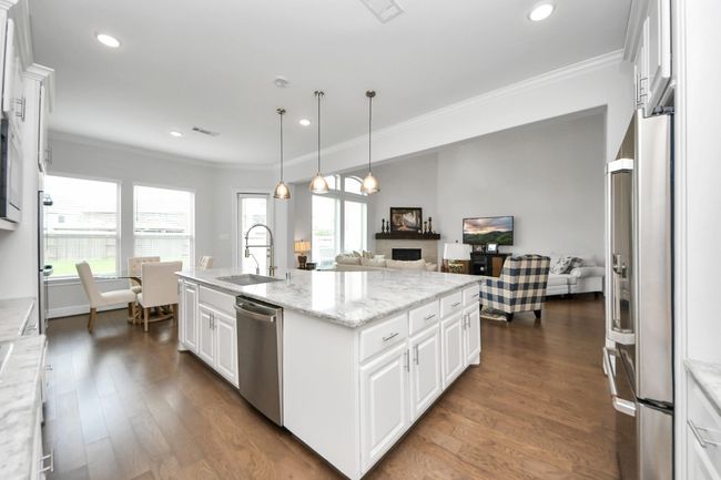 Great for entertaining! Kitchen opens to family room | Image 16