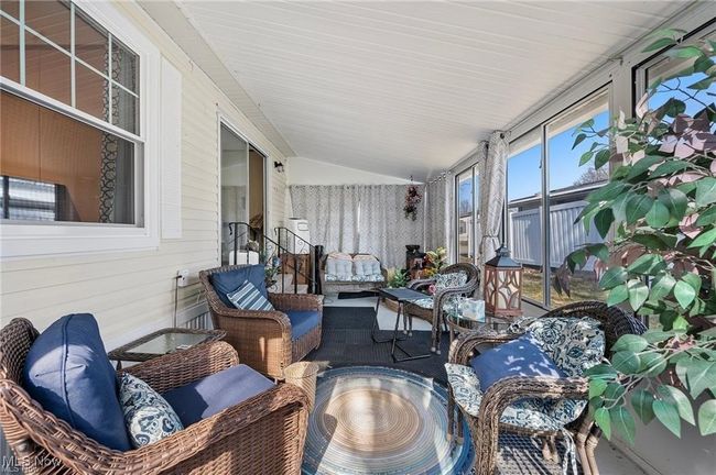Sunroom with vaulted ceiling and an outdoor hangout area | Image 18