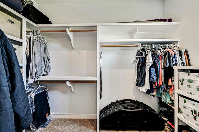 Spacious closet with carpet | Image 21
