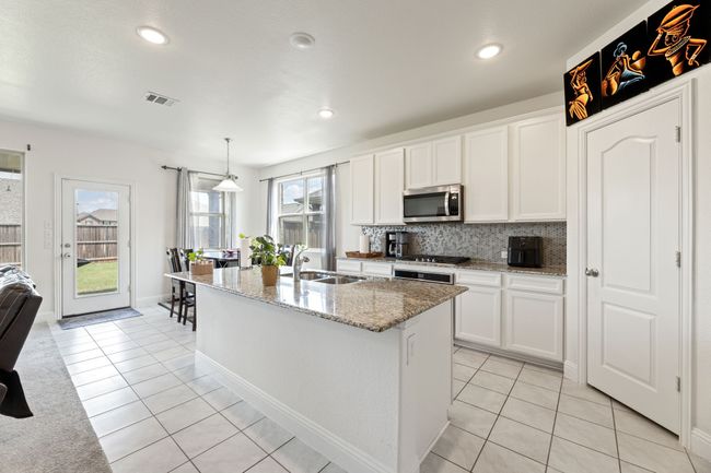 Kitchen featuring corner pantry | Image 19