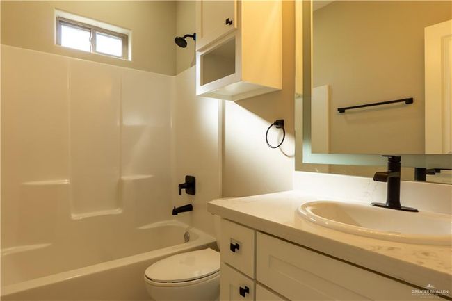 Full bath featuring shower / bath combination, vanity, and toilet | Image 36