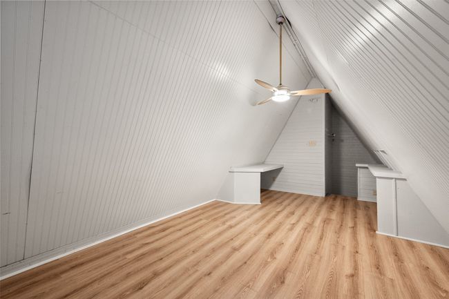 Additional living space with laminate flooring and lofted ceiling | Image 32