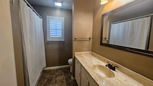 2nd full bathroom located in hallway | Image 15