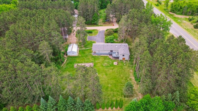 Aerial view highlighting the size of the home and pole building with 2 driveways | Image 8