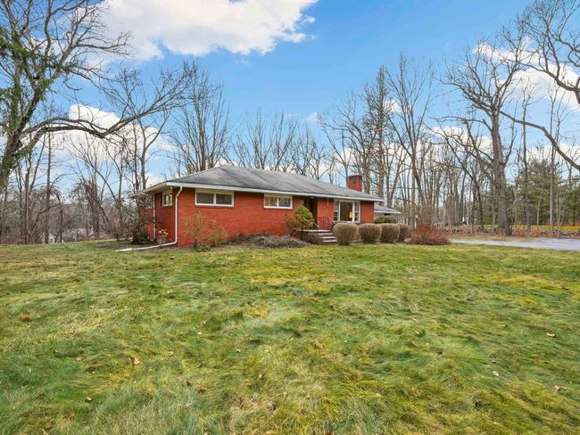 View of side of home featuring a lawn | Image 38