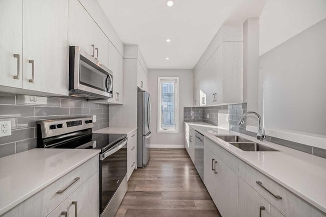 207 Evanscrest Square Nw, Townhouse with 2 bedrooms, 3 bathrooms and 1 parking in Calgary AB | Image 4