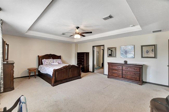 Expansive master bedroom with ample room for relaxation and style. | Image 33