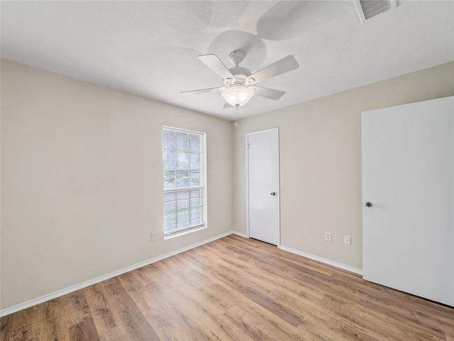 Unfurnished room with light wood-style flooring, ceiling fan, and baseboards | Image 20