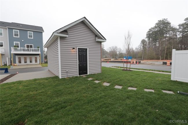 Planned amenities in the community include a 200, 000-square-foot town center with shops and restaurants, a luxury clubhouse with a state-of-the-art fitness center, an Olympic-sized swimming pool, tennis courts, and recreation fields. Watermark is an upscale community nestled around the scenic Watermark Lake in award-winning Chesterfield County, featuring Eastwood Homes' most innovative townhome designs in a beautiful master-planned setting. | Image 7