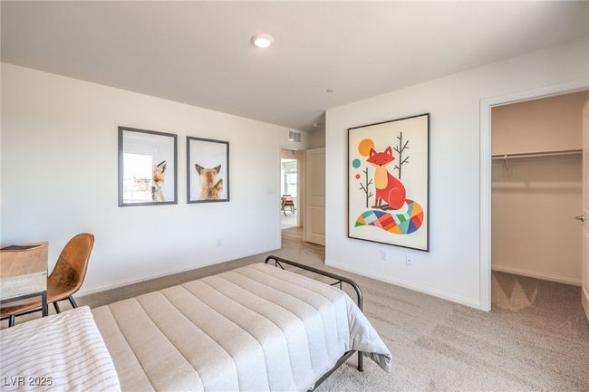Bedroom with light carpet, a walk in closet, baseboards, and recessed lighting. Photo is representational only; actual home finishes may vary. | Image 31