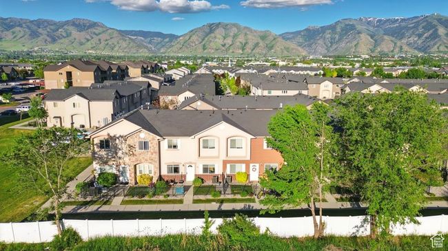 Aerial view of residential area featuring a mountainous background | Image 30