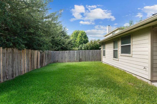 View of fenced backyard | Image 28