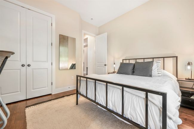Bedroom with wood finished floors and a closet | Image 7