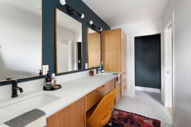 Primary bathroom with dual vanities. | Image 24