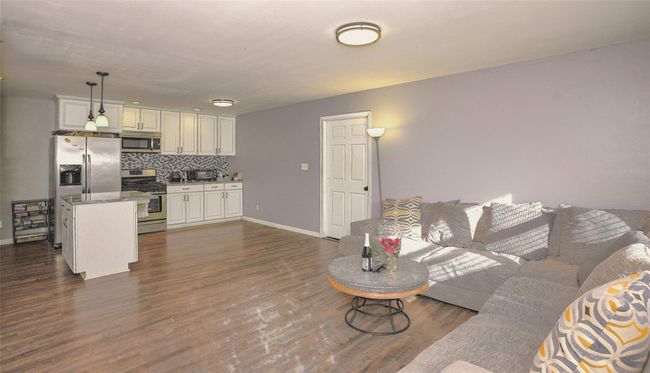Living room with dark hardwood / wood-style floors | Image 6