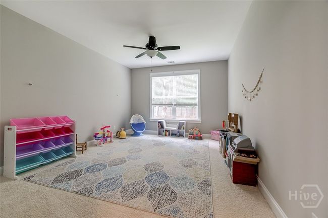Bedroom on the first floor has a private bath attached that seconds as a guest bathroom. | Image 21