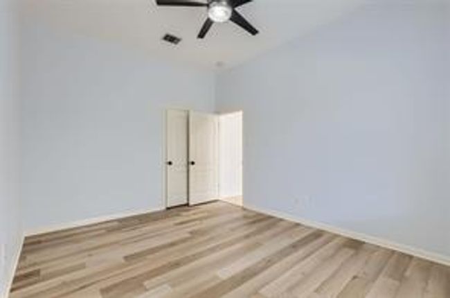 Unfurnished room with wood finished floors and ceiling fan | Image 22