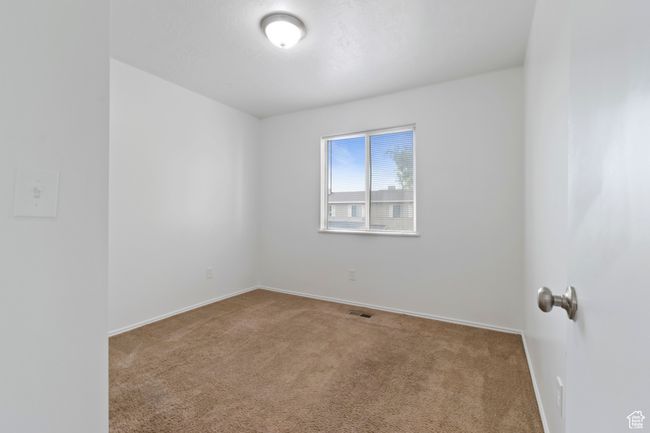 Spare room featuring carpet floors and baseboards | Image 23